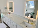 Master Bath with dual sinks and back-lit mirrors